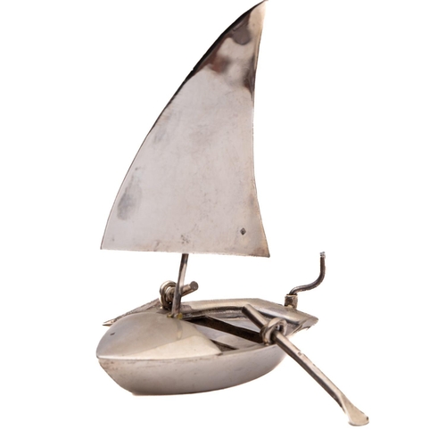 118 - A small silver model of a catamaran: 9.5cm high , together with one other white metal sailing boat a... 