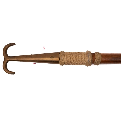 192 - A brass boat hook with ropework decorated shaft: 136cm long