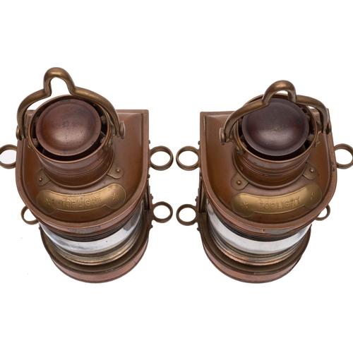 206 - A pair of Indian copper and brass toplights, both with swing handles over chimney and clear glass le... 