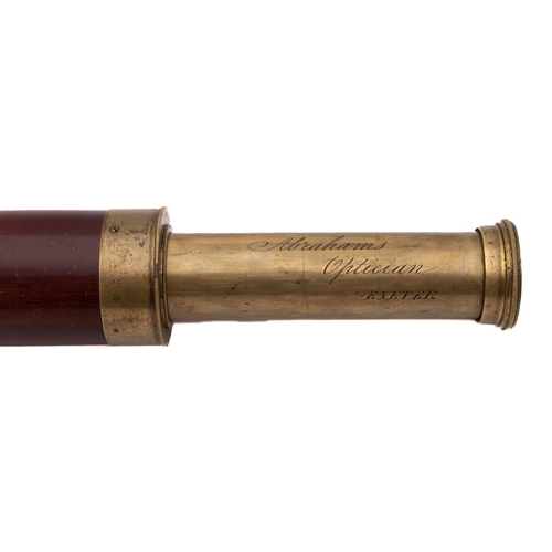 236 - A late 19th/ early 20th century mahogany and brass two draw telescope:  inscribed  'Abrahams Option,... 