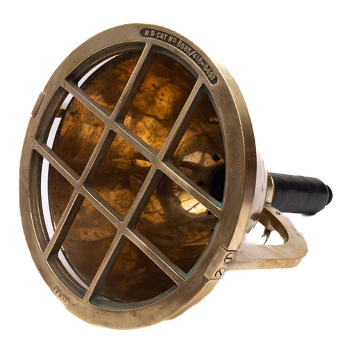 386 - A brass diver's light: the 12 inch housing with guard stamped 'NS cat No. 0583/412-8481' with double... 