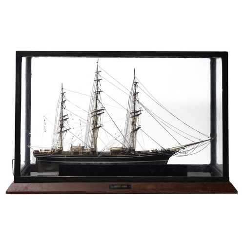 407 - A cased  scale model of the Cutty Sark standing and running rigged over decks with lifeboats, davits... 