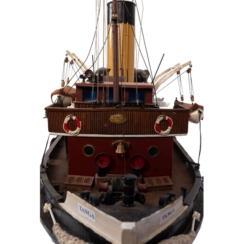 410 - A scale model of the tug 'Tanga':  fitted black banded cream stack , aerial masts, bridge lifeboats ... 