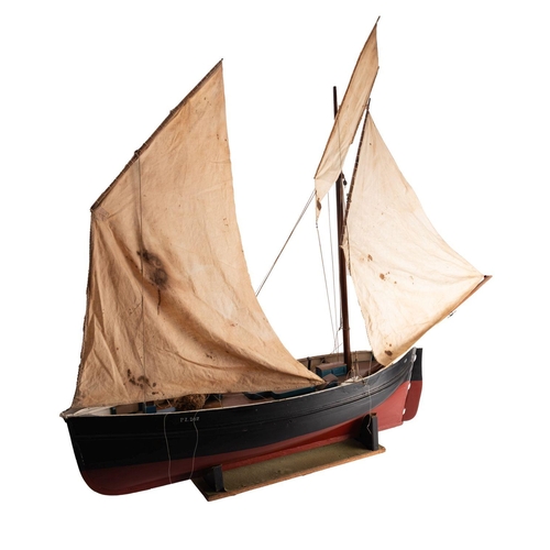 411 - A scale model of a Penzance Lugger 'PZ207': set full sail over simulated plank deck,  with capstan, ... 