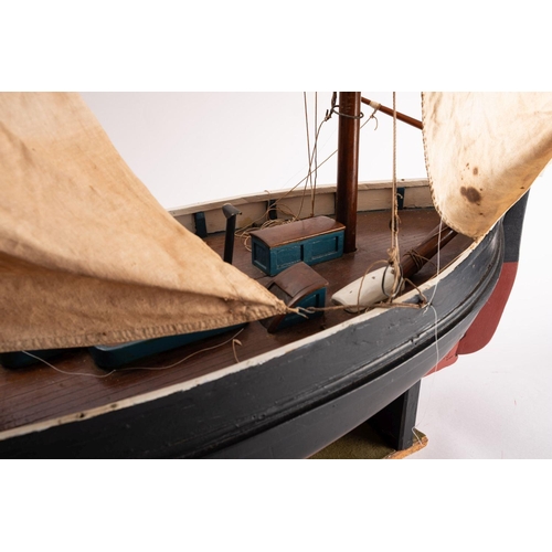 411 - A scale model of a Penzance Lugger 'PZ207': set full sail over simulated plank deck,  with capstan, ... 