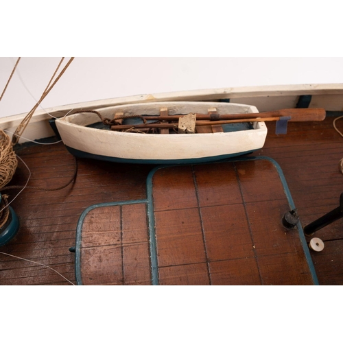 411 - A scale model of a Penzance Lugger 'PZ207': set full sail over simulated plank deck,  with capstan, ... 