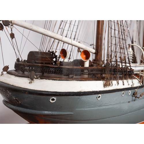 421 - A cased scale model of the sailing ship 'Cicely': standing and running rigged over planked deck with... 