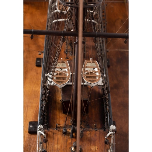 421 - A cased scale model of the sailing ship 'Cicely': standing and running rigged over planked deck with... 