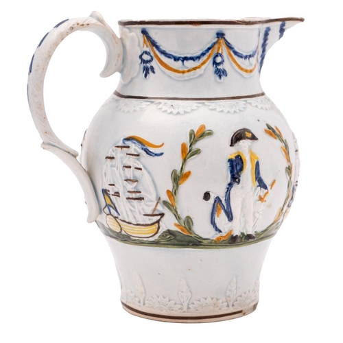 99 - A small Pratt ware 'Admiral Nelson' jug, circa 1800: scroll handle with blue glaze husks, the body w... 