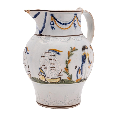 99 - A small Pratt ware 'Admiral Nelson' jug, circa 1800: scroll handle with blue glaze husks, the body w... 