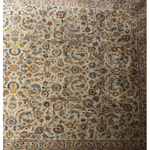 1320 - A Kashan carpet, the pastel grey field with an all over design of palmettes and scrolling floral fol... 