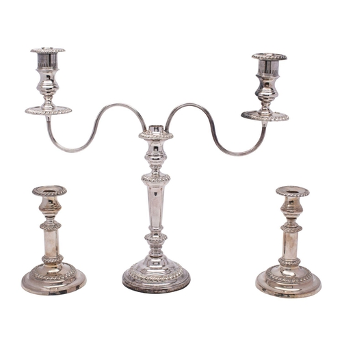 2007 - A 19th century Old Sheffield Plate twin branch candelabrum with gadrooned rims and reeded scroll arm... 