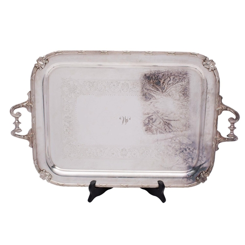 2008 - An Edward VII silver plated twin-handled tea tray, rectangular with engraved foliate scroll band, sc... 