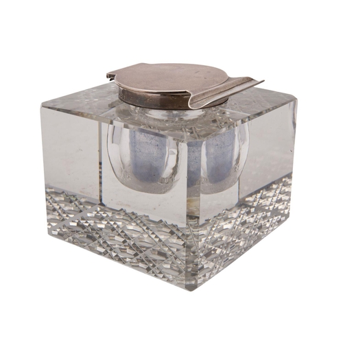 2135 - A George V silver and glass inkwell, made and retailed by Finnigans Manchester, 1912, the hinged sil... 