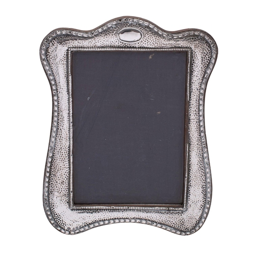 2148 - WITHDRAWN A George V silver photograph frame, Boots Pure Drug Company,  Birmingham, 1921, of shaped ... 