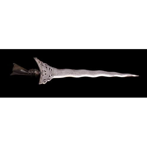 2169 - An Indonesian silver paper knife, in the form of a kris with buffolo horn handle, stamp in Arabic sc... 