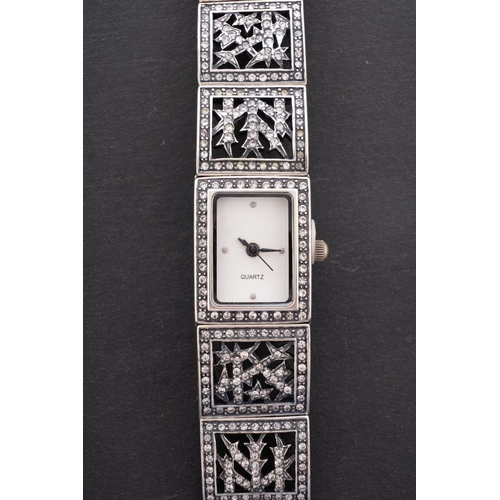 2288 - Barruci, a Faberge style wristwatch, with inset paste to the white-metal case and matching gate-brac... 