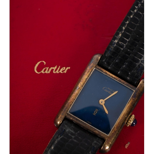 2304 - Must du Cartier, a lady's  gold-plated wristwatch the blue dial signed Must du Cartier with the tank... 