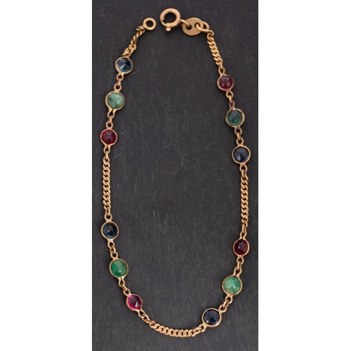 2733 - A flattened, curb-link, spectacle-set emerald, sapphire and red spinel bracelet, stamped '18K', tota... 