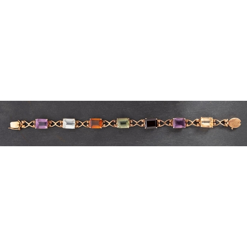 2740 - An octagonal, step-cut, vari-coloured gemset bracelet, including citrine, garnet, aquamarine and par... 