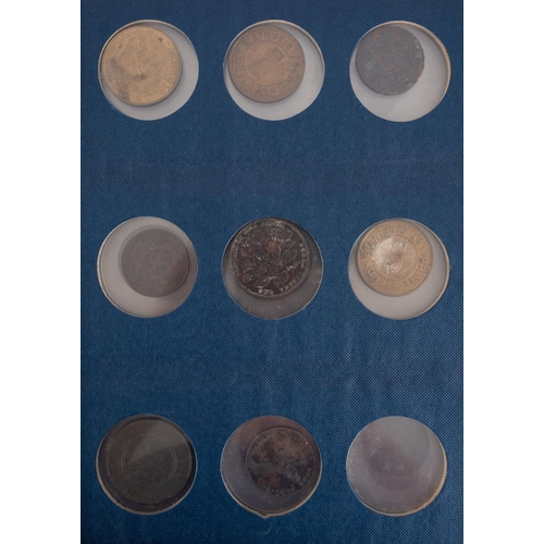 107 - An album of mixed coins and tokens.