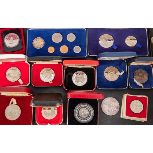 128 - A large bag of proof sets, crowns etc including silver.