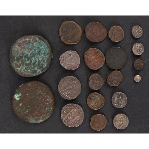 129 - Two 38mm late Ptolemaic coins with a group of Indian coins.