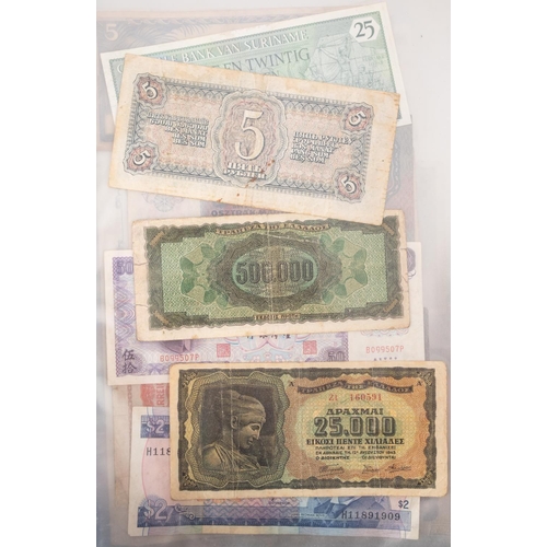 169 - An album of world banknotes.