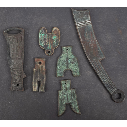 173 - Six pieces of Chinese currency including Knife and spade money contained in an old Hong Kong and Sha... 