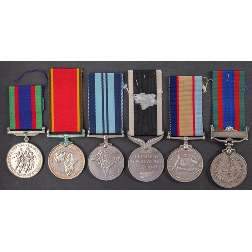 198 - A  group of five WWII medals, comprising Africa Service Medal, Australia Service Medal, New Zealand ... 