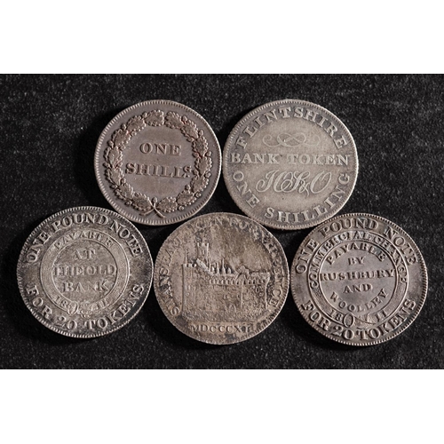 41 - Five 19th Century silver shilling tokens including Swansea, Nantwich, Bilston, Flintshire and Fazele... 