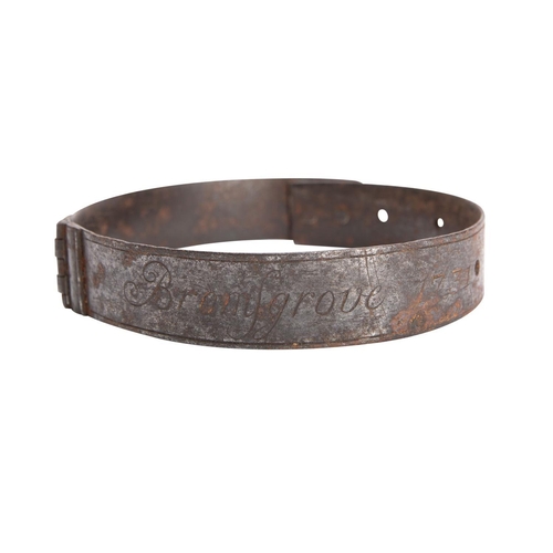 429 - A George II iron dog collar , inscribed 'Potter Yearnold. Bromsgrove 1731', 10cm diameter