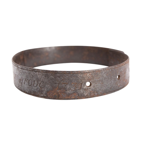 429 - A George II iron dog collar , inscribed 'Potter Yearnold. Bromsgrove 1731', 10cm diameter