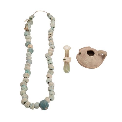 438 - A Roman glass phial together with an antique  bead necklace, both with manuscript labels dated '1878... 