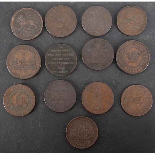 53 - Thirteen 19th Century copper penny trade tokens, including Anglesey and Camarthen.