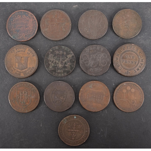 53 - Thirteen 19th Century copper penny trade tokens, including Anglesey and Camarthen.