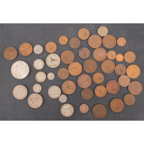 78 - A group of Irish coins including a silver half crown Florin, 1928 and sixpence with a Rhodesia half ... 