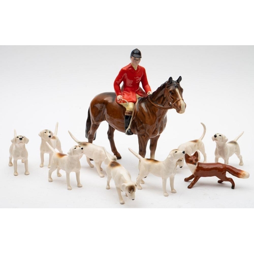 519 - Beswick Huntsman model 1501, brown colourway; together with eight hounds and fox.
