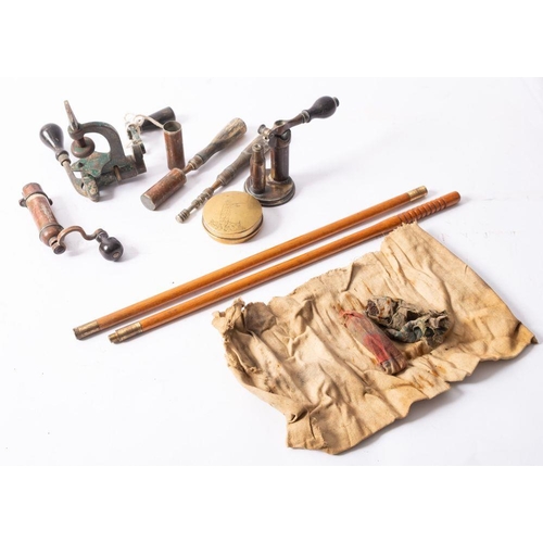 562 - A group of three brass cartridge tools, unsigned, together with  two brushes, a set of cleaning rods... 