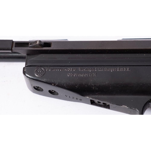 604 - A Feinwerkbau Mod 65 .177 calibre target air pistol, serial number 96214, with ergonomic wooden grip... 
