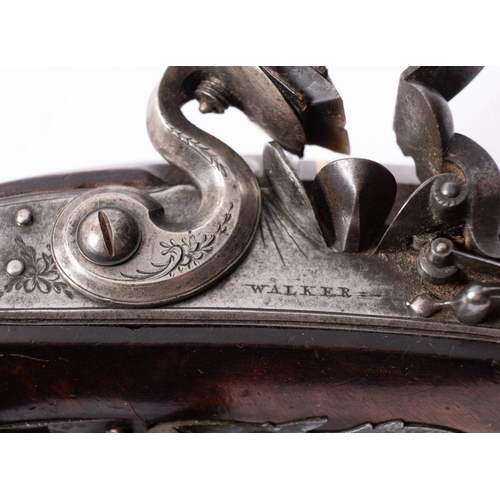 637 - A late 18th/ 19th century flintlock pistol by Walker of London, the sighted 10 inch octagonal Damasc... 