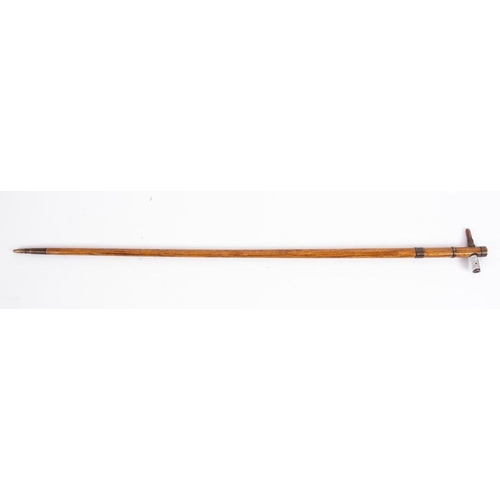 832 - A WWI German trench art walking cane, the ash shaft with copper ferrules and bullet handle, with bul... 