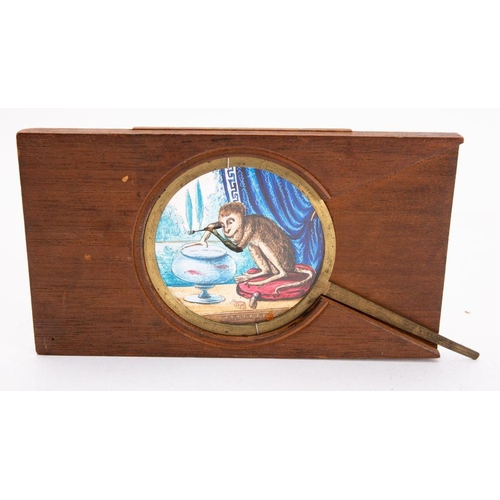 964 - A 19th Century magic lantern  lever slide of a monkey  with a fork over a fish bowl, unsigned, 10 x ... 