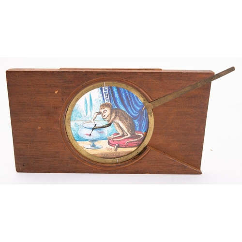 964 - A 19th Century magic lantern  lever slide of a monkey  with a fork over a fish bowl, unsigned, 10 x ... 