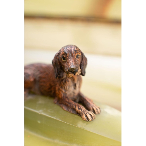 527 - A mid 20th century cold painted bronze model of a dog on a green onyx pen stand base:,10.5cm wide, t... 