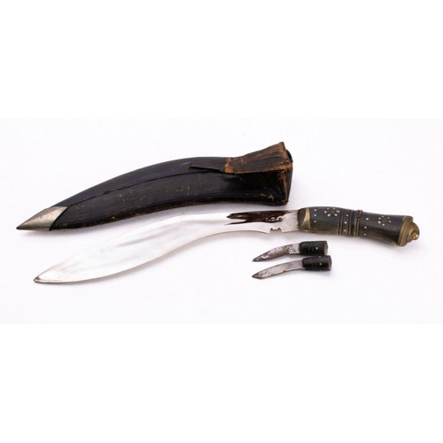 650 - An early 20th century horn handled  kukri,  the nickel plated  blade with stipple decoration  stampe... 