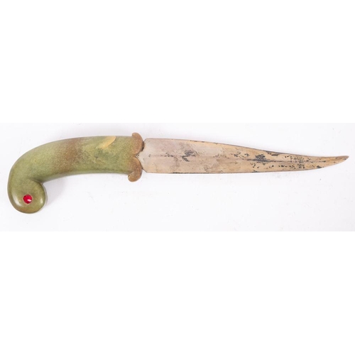 672 - An Indo -Persian jade handled Pesh Kabz, the slightly curved single edge blade  over a one piece  ja... 