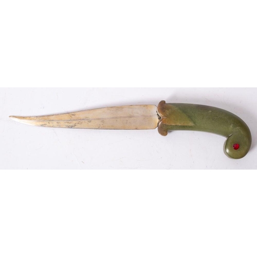 672 - An Indo -Persian jade handled Pesh Kabz, the slightly curved single edge blade  over a one piece  ja... 