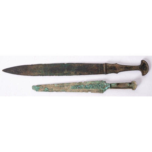 720 - A Chinese short sword after the antique and a similar dagger, both of one piece construction, 40cm a... 