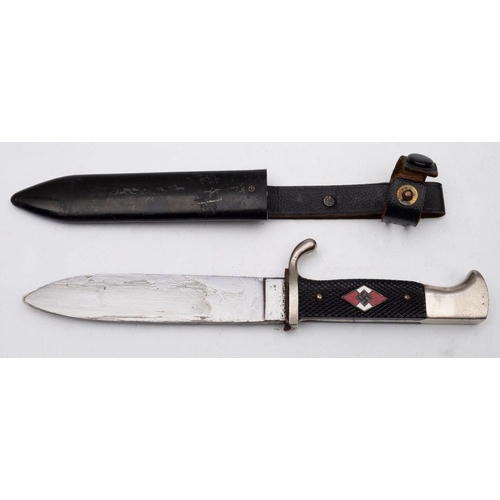 734 - A Replica Hitler Youth Dagger, the straight single edge blade, over single quillon hilt and two piec... 